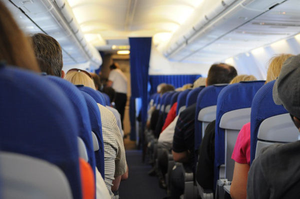 child car seat plane aisle view